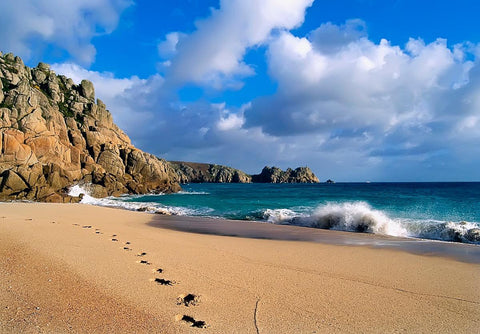 Amateur beach nudists stretching on the golden sand